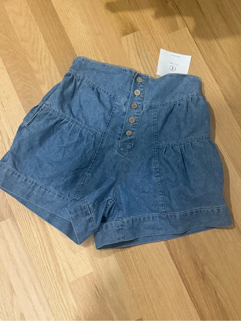 High waisted light blue denim button up shorts / Size 4